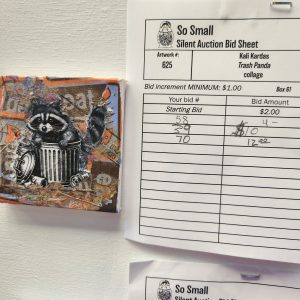 A photo of a miniature portrait of the a raccoon on display at the 2024 So Small Miniature Art Auction